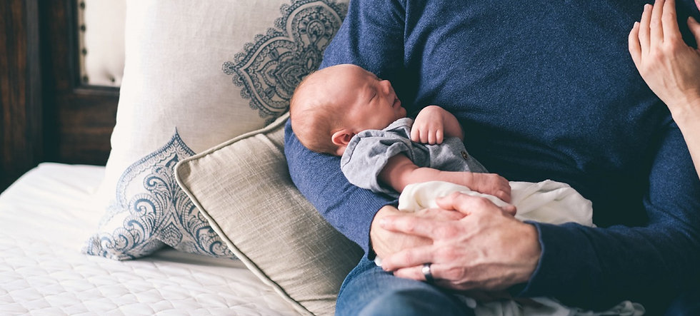 Man Holding Newborn