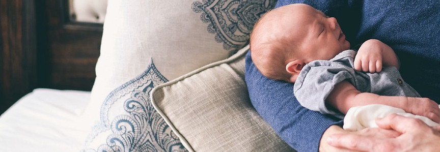 Man Holding Newborn