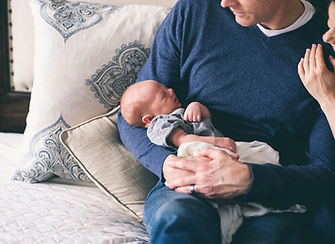 Man Holding Newborn