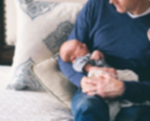 Man Holding Newborn