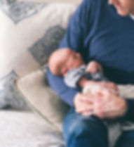 Man Holding Newborn