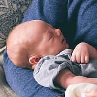 Man Holding Newborn