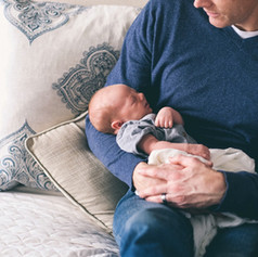 Man Holding Newborn