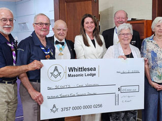 Members of Freemasons Victoria, Whittlesea Lodge and Freemasons Foundation Victoria present a donation in the form of a large cheque to the Whittlesea SES to the value of $26,000