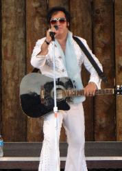 Singer in an Elvis outfit with a guitar