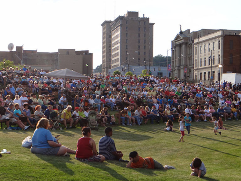 Large crowd sitting in the Berkman Amphitheater