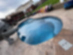Fun pool setup featuring colorful chairs and a pool slide