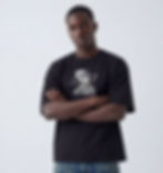 Man in black t-shirt with graphic, arms crossed