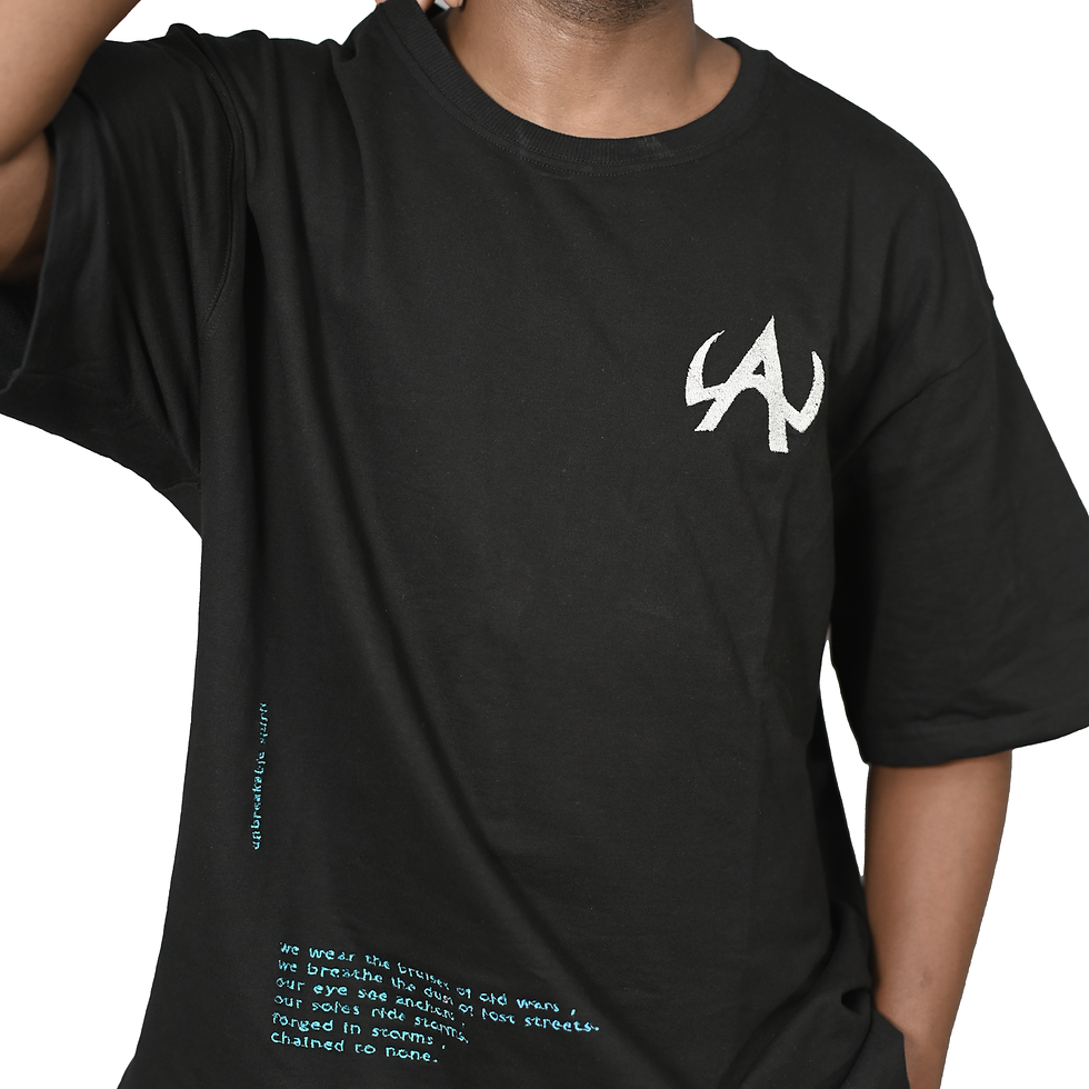 front view of model wearing black anchor oversized tshirt with detailed wilde amor logo and dripping font.
