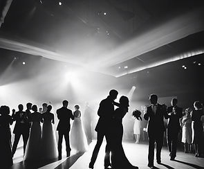 romantic black and white image of silhouettes of people on the dance floor at a wedding.jpg