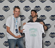 Quincy and Nick Apostolides with SCUBA Q T Shirt