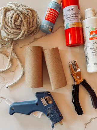 DIY cardboard pretend play binoculars using toilet paper rolls, acrylic paint, and yarn