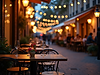 atmospheric-shot-of-outdoor-dining-on-a-charming-street-under-warm-twilight-lights.png