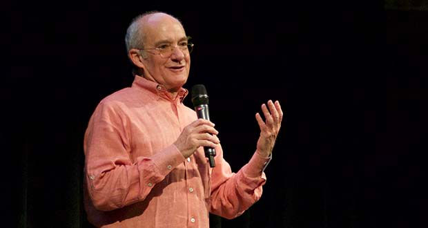 Jed Dietz, founding director of the Maryland Film Festival, speaking into a microphone at a festival event.