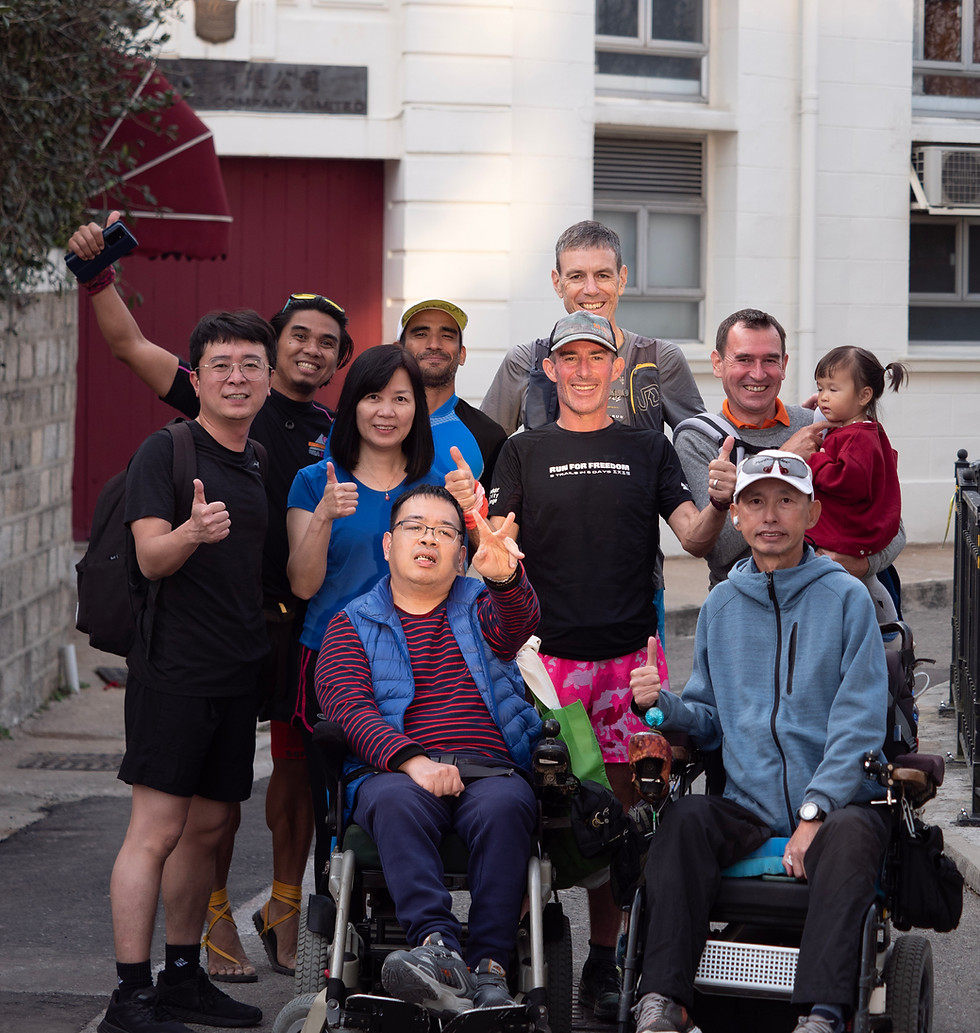 Jo Lodder celebrates with disabled teammates after completing 3 of 5 trails in his 5in5 challenge