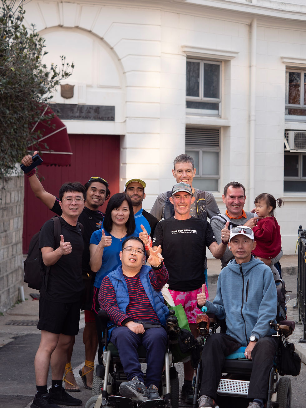 Jo celebrates finish line with disabled teammates.
