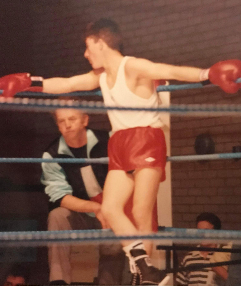 Jo strategizing with boxing trainer.