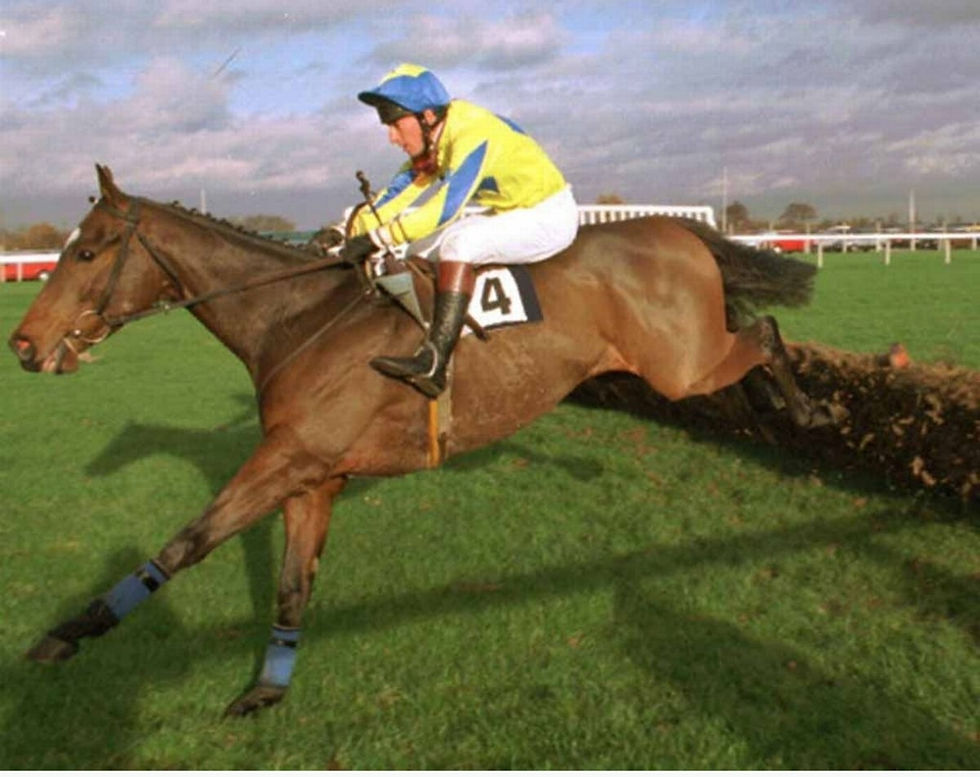 Close-up view of a jockey’s boots and reins on a racehorse