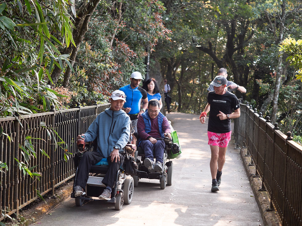 Jo runs alongside adaptive athletes, promoting inclusion.