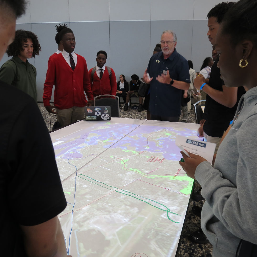 Dr. Russ Clark from Georgia Tech's CEAR Hub guides students through a map spot activity, fostering hands-on learning and engagement.
