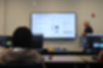 Dr. Russell Clark from Georgia Tech presents to campers, integrating coding activities for environmental sensor and weather app development, enhancing their understanding of marine science in daily life.