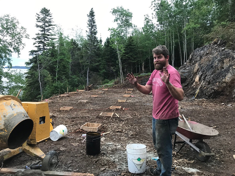 Mixing cement to pour cement pad foundation