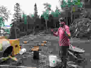 Mixing cement to pour cement pad foundation
