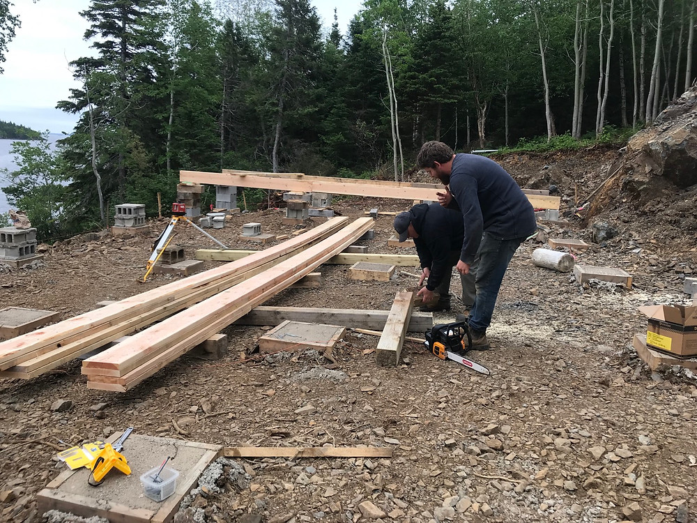Laminating 2x10 lumber to make 26' long stringer support beams for our diy cabin foundation