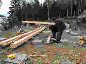 Laminating 2x10 lumber to make 26' long stringer support beams for our diy cabin foundation