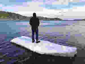 Mike standing on a piece of ice that grounded out on the beach by our land.