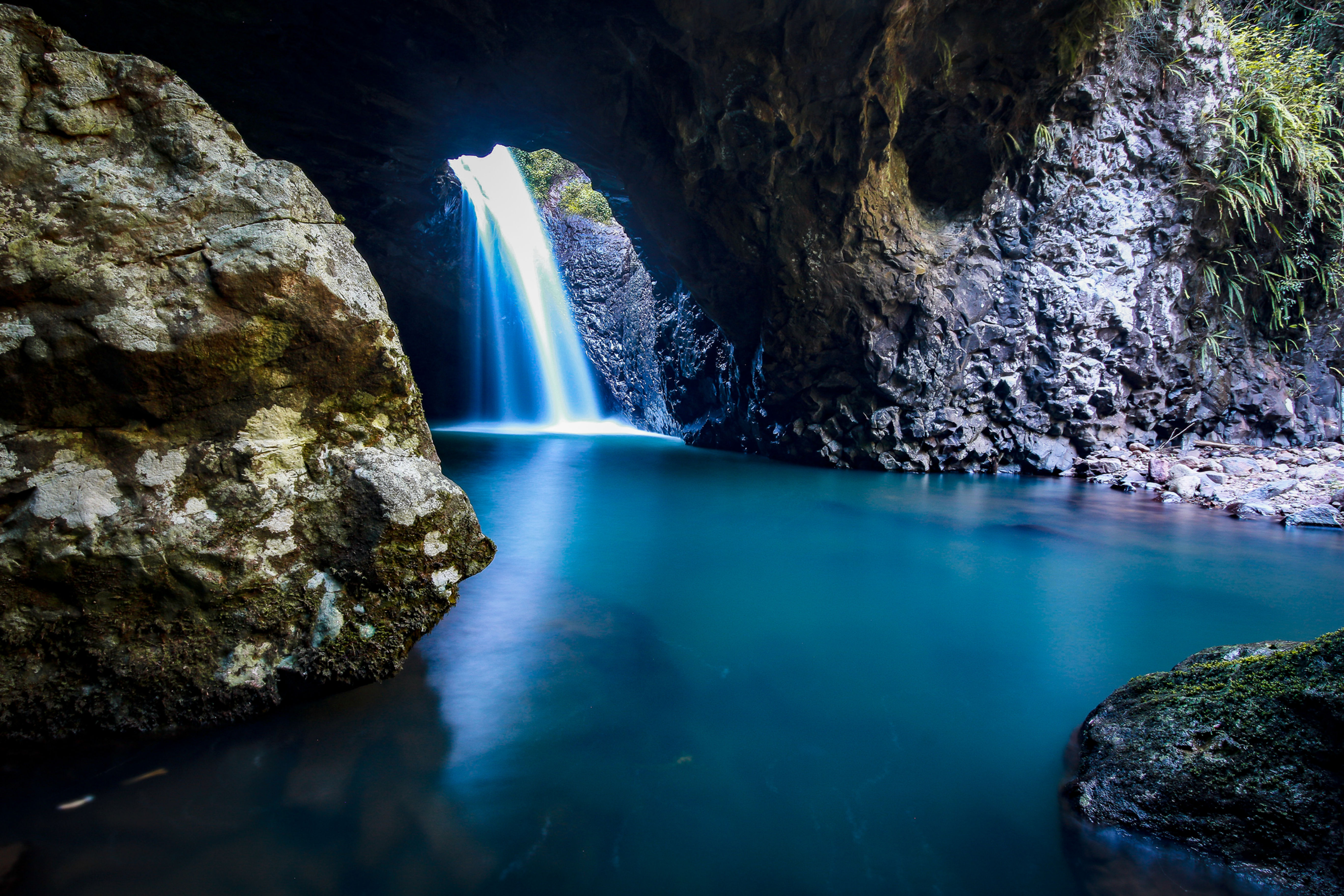 Smooth watered waterfall at Natural Bridge, Springbrook.