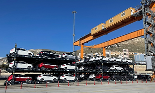 Vehicles loaded on flat-racks 