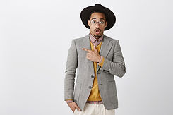 surprised-african-american-man-suit-asking-question-pointing-upper-left-corner-amazed.jpeg