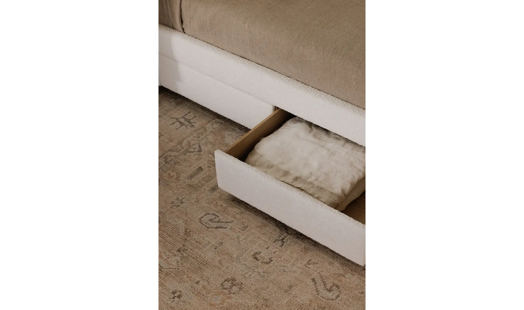 Close up of storage drawers under bed