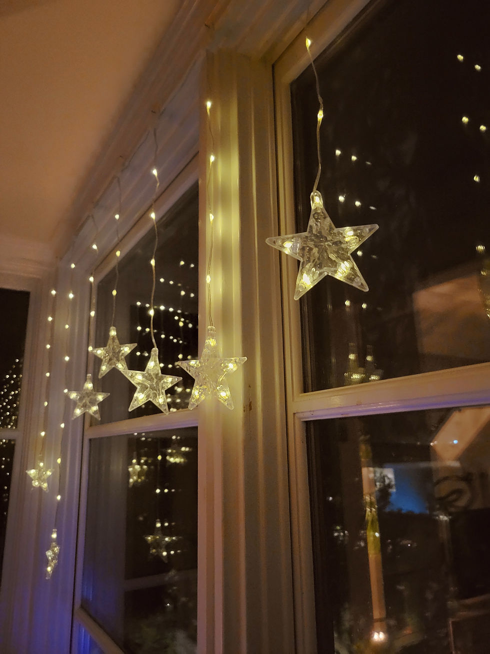 Twinkle lights in a window