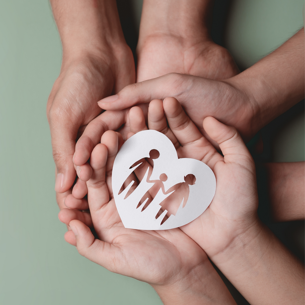 Hands Holding a Paper Heart