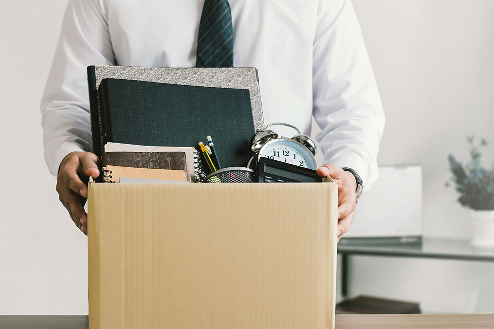 man holding his work items after resigning