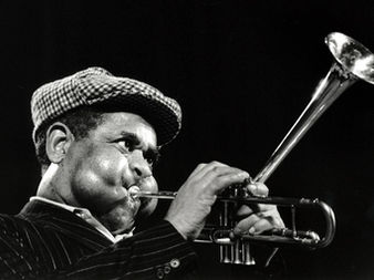 Trumpet player with puffed cheeks.