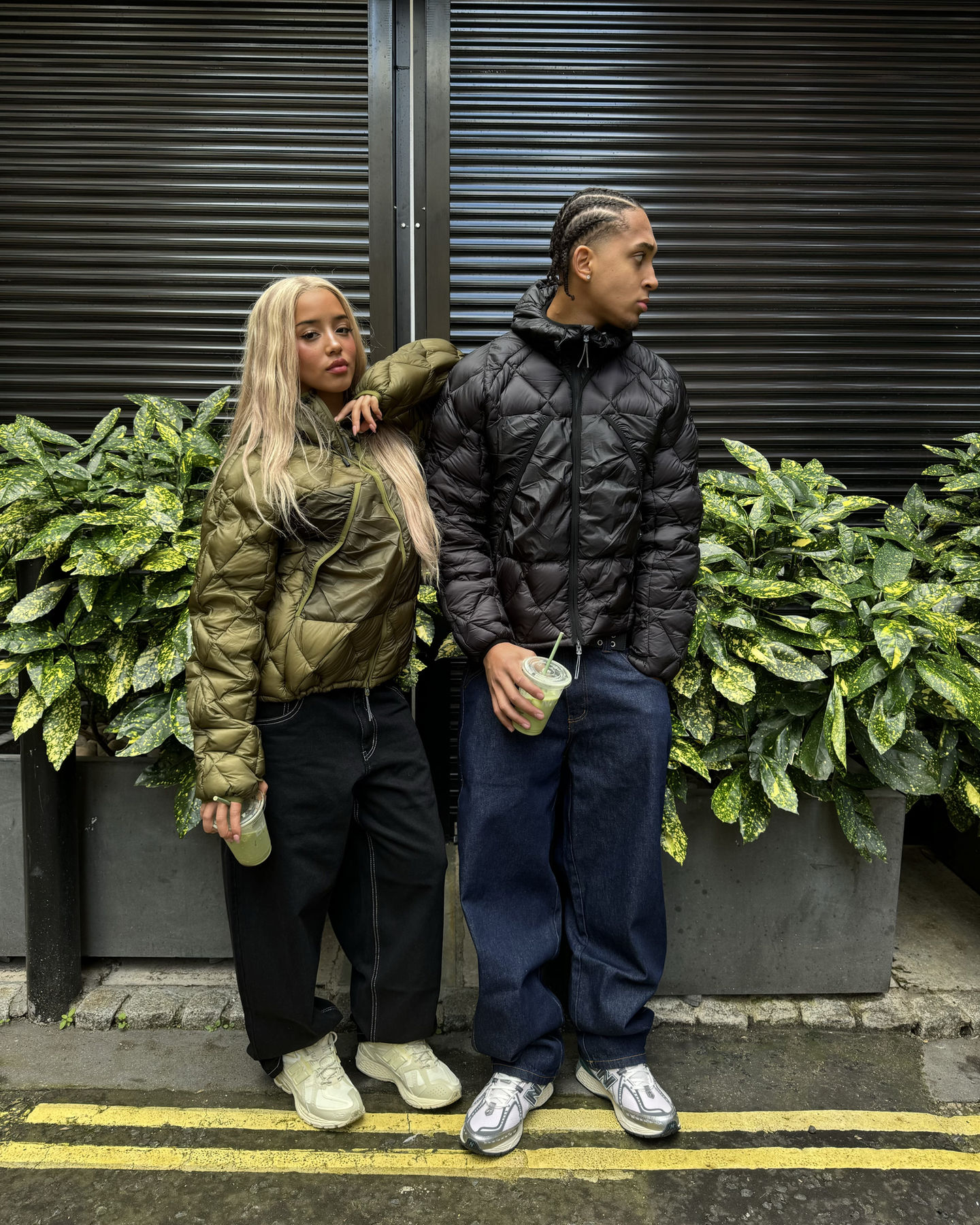 streetwear couple wearing puffer jackets with matcha