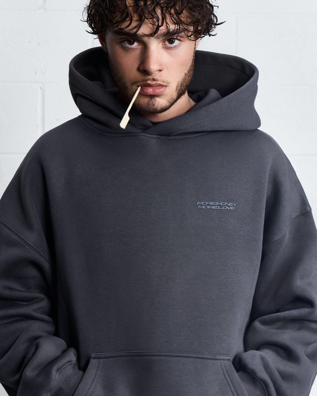 More Money More Love model wearing tracksuit