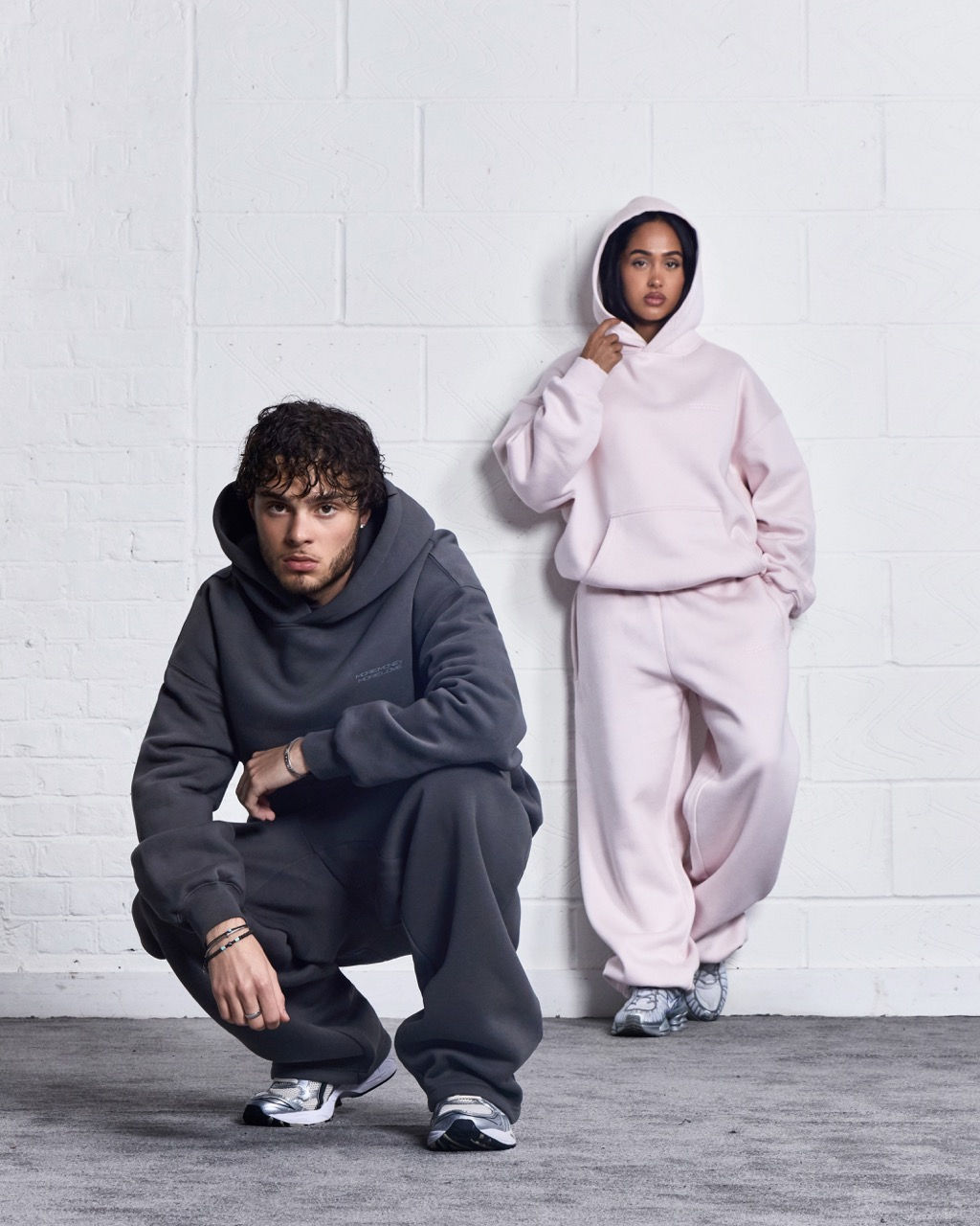 More Money More Love duo wearing tracksuit