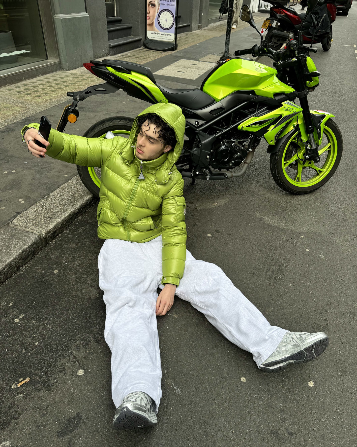 matching the moncler jacket with the motorbike.