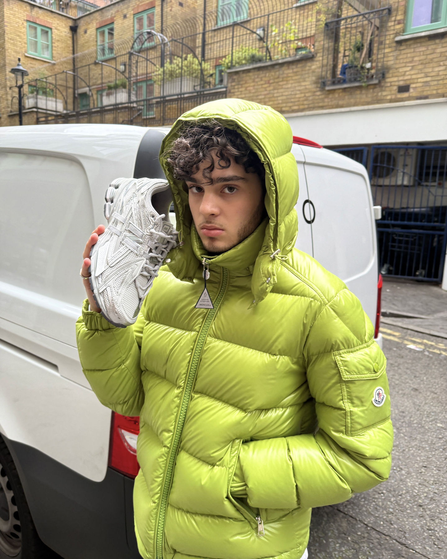 model posing in streetwear outfit with new balance trainers