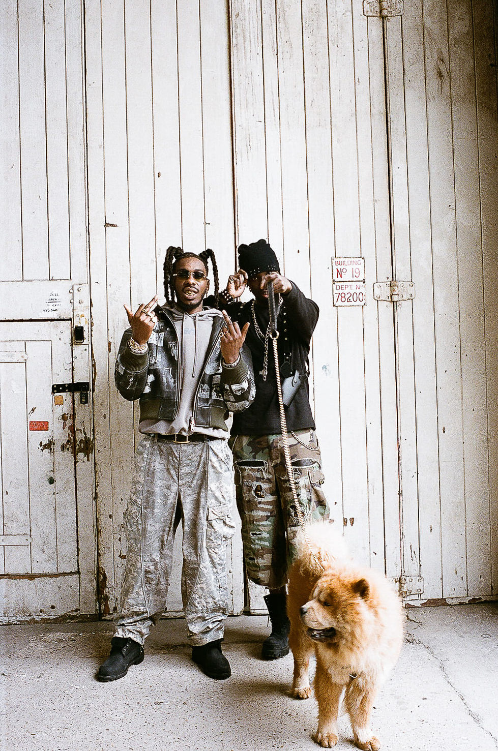 full body of rappers posing for music video