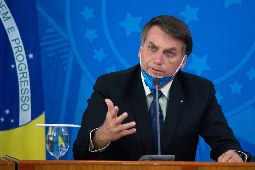 O então presidente Jair Bolsonaro participa de entrevista coletiva durante a pandemia (Getty Images)