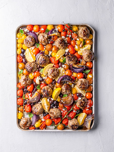 Greek Lamb Meatballs Bake with tomatoes, feta, and olives — Mediterranean traybake recipe by Peter Sidwell