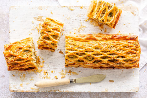 Golden Fennel Sausage Wellington sliced open to reveal fennel and apple sausage filling — Peter Sidwell recipe