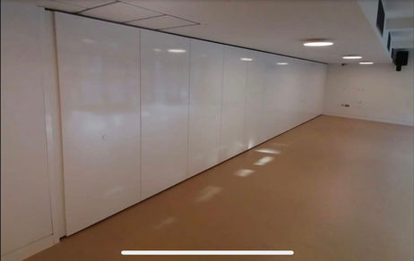 Close-up of the A100 solid movable wall system installed