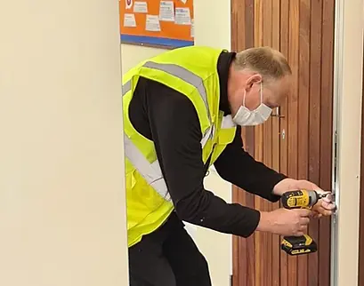 Staff member carrying out a repair