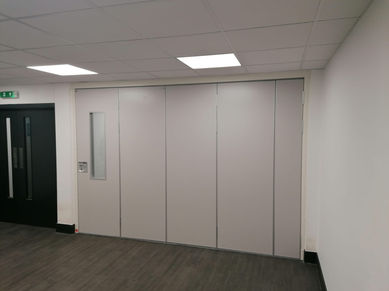 ASF100 sliding-folding wall system with door option